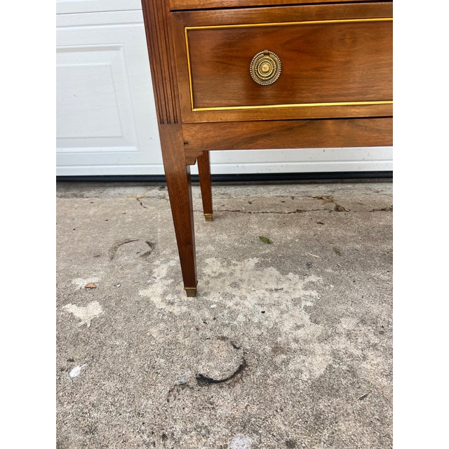 Elegant 19th-century French Louis XVI commode crafted in walnut with beautiful figured veneer. Featuring two small over...