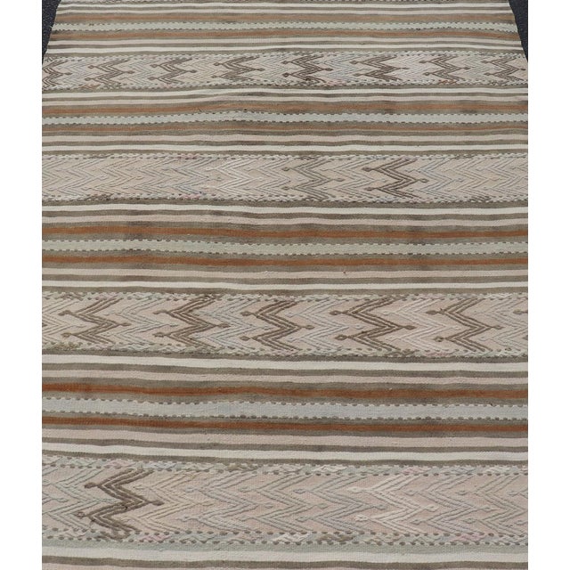 Turkish Kilim vintage carpet in light taupe, green, Tan, Light Brown, and beige and cream. Keivan Woven Arts / rug...