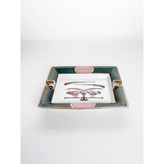 Elegant French ceramic ashtray dating from the 1970s, inspired by the iconic equestrian designs associated with Hermès....