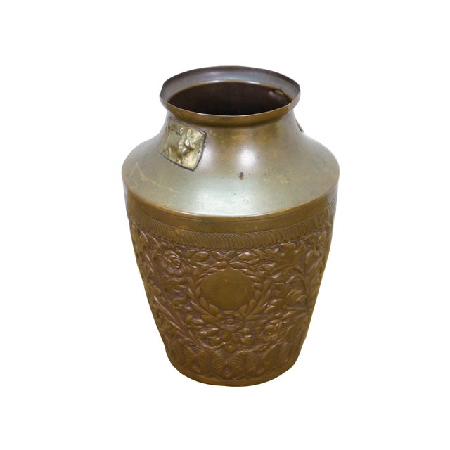 Vintage embossed brass Neoclassical foliate wreath cow bull plaque bud vase / mantel urn. Dimensions: 5.5" x 6.75"...