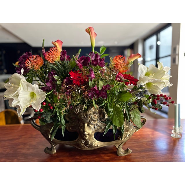 Beautiful antique bronze Jardiniere fitted with a cobalt glazed cachepot / low vase. Perfect as a centerpiece filled with...
