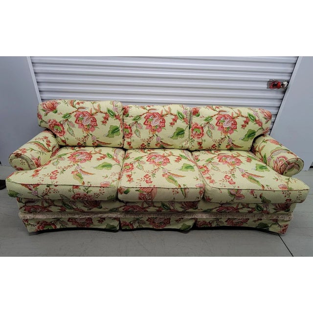 Traditional American sofa and ottoman custom upholstered in 1997 with Cyrus Clark fabric. Has a great look and includes 2...