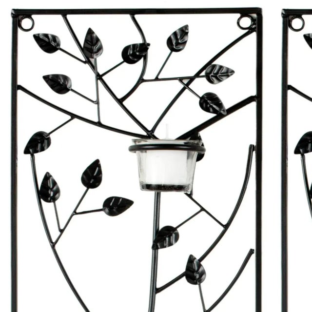 This modernized vine and leaf wall sconce, carefully wrought from iron, features five glass candle holders on each of it's...