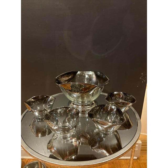 Add a touch of Mid-Century Modern charm to your dining table with this vintage five-piece serving bowl set by Dorthy...