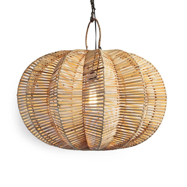 Handmade split raw rattan pumpkin lantern. Overall measurements are 24" x 24" x 20" with 4" top ring. Each lantern may...