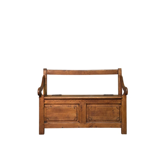 Antique two-seater chest made of chestnut wood, dating back to the 19th century, featuring a seat and armrests. Solid and...