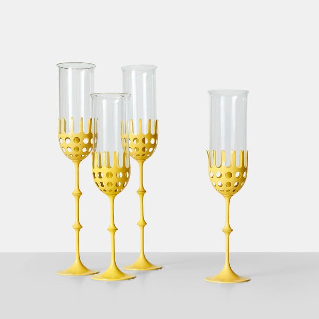 Description Bjorn Wiinblad Hurricane Lamps Four hurricane lamps painted yellow with glass shades. Height adjustable with...