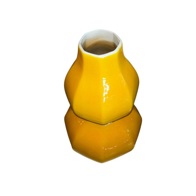 This striking vintage Imperial‑style vase features a vibrant, high‑gloss yellow glaze and a distinctive double‑gourd...