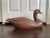 A vintage life size goose decoy, crafted from composite material, possibly resin. This large bird features a faux wood...