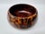 A substantial vintage salad bowl with matching serving spoon and fork, hand-shaped from richly figured exotic hardwood....