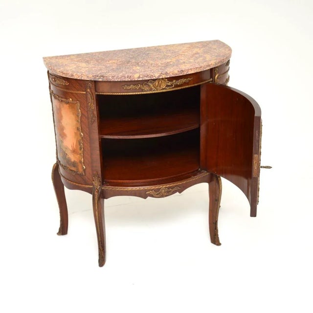 A stunning antique French marble top painted cabinet. This was made in France, it dates from around the 1920-30’s. It is...