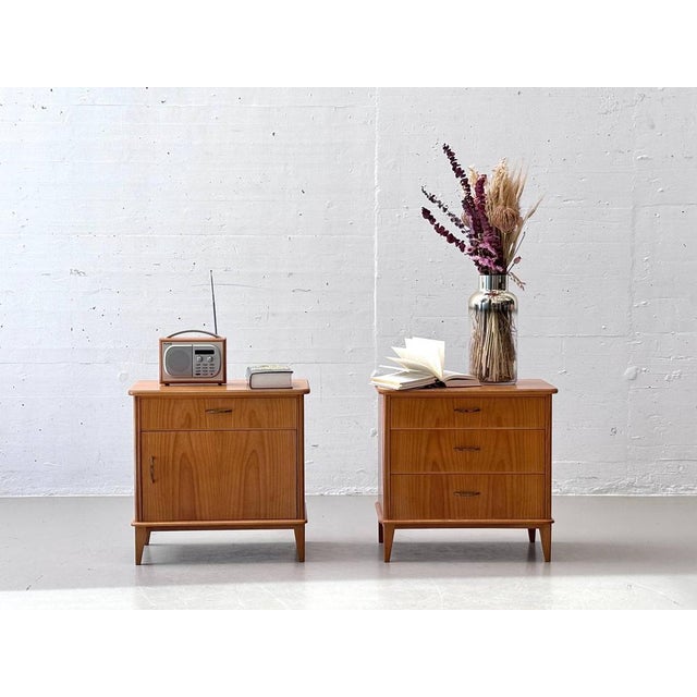 This stylish bedside table set combines timeless mid-century design with high-quality craftsmanship. Made from warm,...