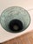 Striking Lazy Susan art glass pedestal vase featuring a beautiful verdigris-inspired finish in layered sea glass green and...