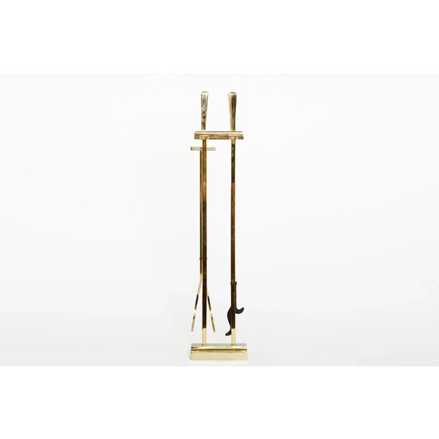 Elegant and beautiful set of five piece solid brass Italian fire tools on stand with art deco details finial tops resting...