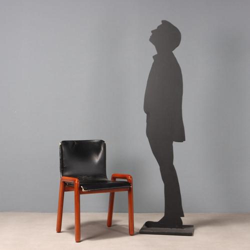 Dining chair with wooden frame, black leather seat. This piece is attributed to the mentioned designer/maker. It has no...