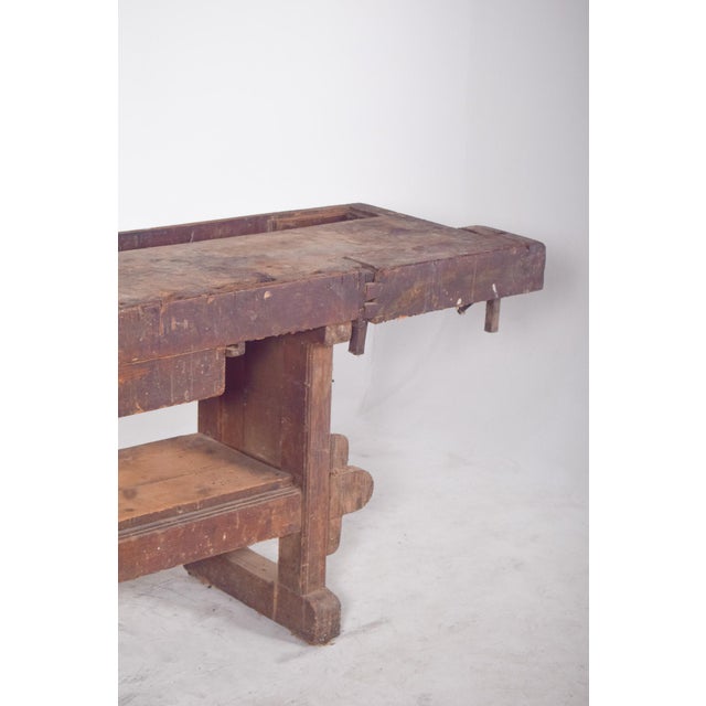 Cabinetmaker's work bench. This solid wood carpenter's bench carries the history of the craft in every mark and wear...