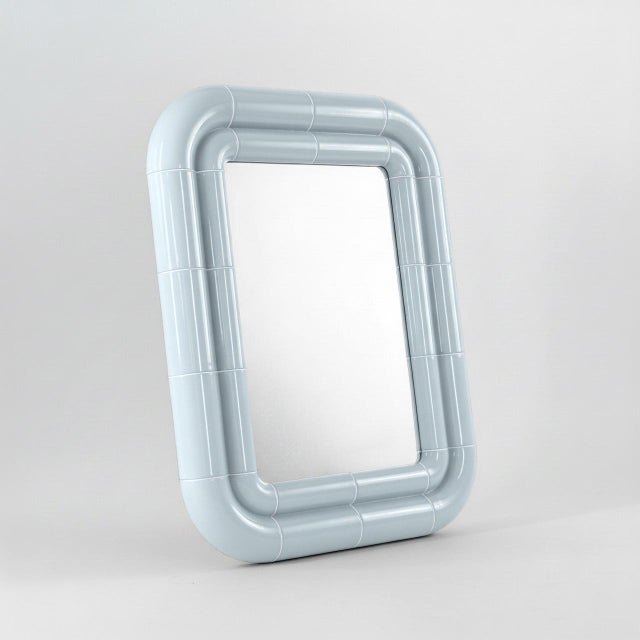 Portalito is built on repetition. A continuous tubular structure that wraps, doubles, and frames — creating depth where...