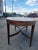This English 19th century mahogany oval conference table is a beautifully crafted antique piece that exudes elegance and...