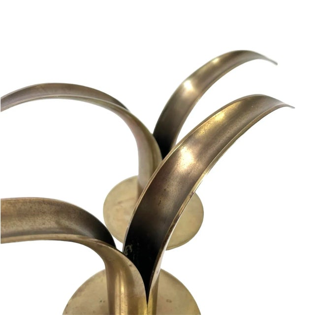 Add a Scandinavian flair to your tabletops with this beautiful pair of iconic brass candlesticks designed by Ivar Alenius...