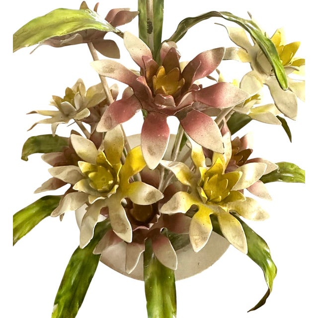 A lovely, vintage tole floral arrangement. Features hand painted blooms in delicate shades, surrounded by green leaves in...