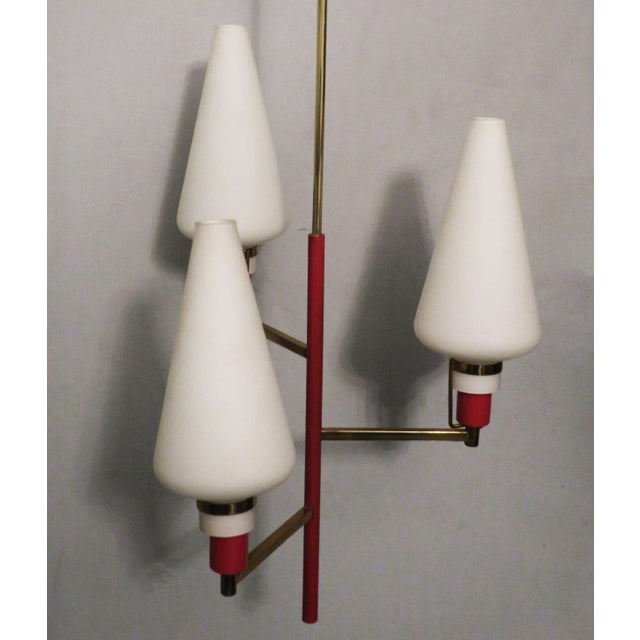 Fine Italian 3-light chandelier from the time of the first Stilnovo wave, about 1950. Slender milk glass shades on narrow...