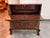 Design Plus Gallery presents an Antique Korean Drop Front Storage Desk. The case presents paneled woodwork, carved bracket...