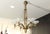 This French Art Deco chandelier by Petitot features six original waterfall opaline glass shades on antique brass. The...