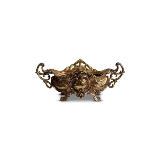 This Antique Brass Art Nouveau Jardiniere Rococo Footed Bowl boasts detailing inspired by the Art Nouveau movement,...