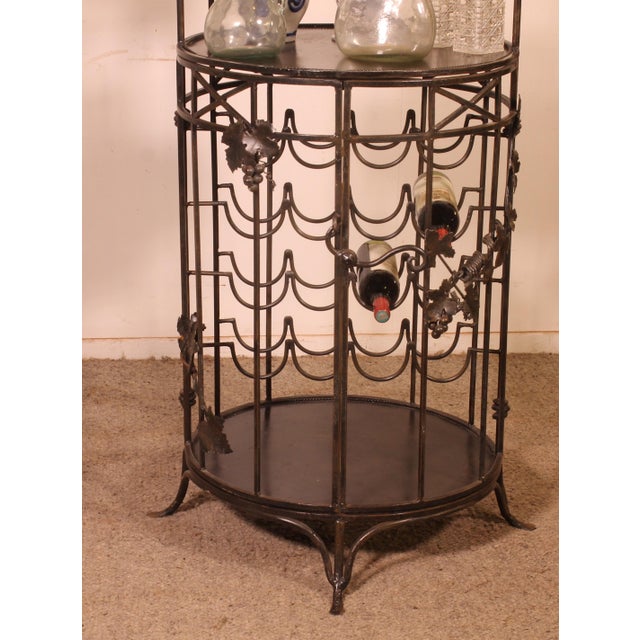 An elegant wrought iron bar counter dating from the mid-20th century, with a particularly striking decorative and...