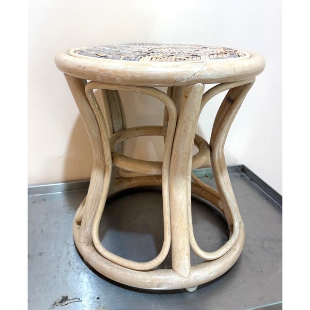 1960s-70s light-washed rattan woven-top footstool/ottoman. Some mild fading/discoloration to woven top surface in a couple...