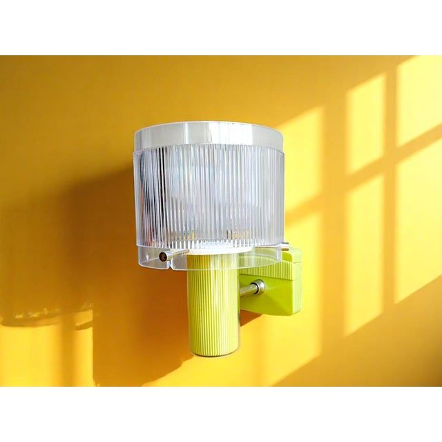 New vintage wall sconce. Made in portugal by vivaldi. it is made of plastic and acrylic material. The plastic base is in...