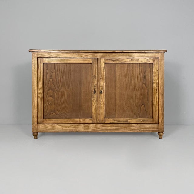 Italian wooden sideboard, late 1800s Storage unit or sideboard made entirely of wood, with double hinged doors with locks...