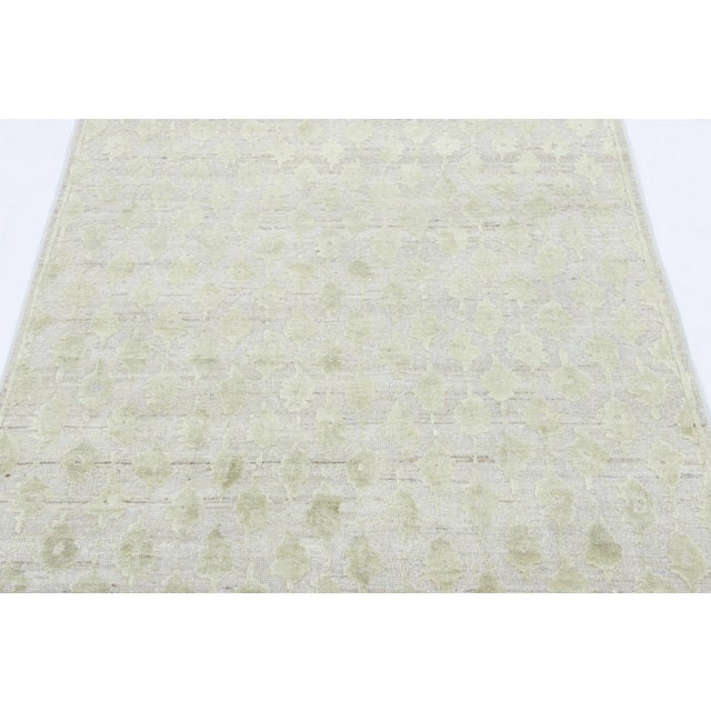 Hand-knotted in a luxurious blend of wool and silk, this 3x5 rug is a radiant and sophisticated addition to the Rug &...