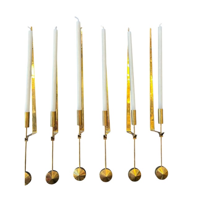 8 wall-mounted candleholders by Pierre Forsell, crafted circa 1960, epitomizes the elegance of mid-century design. Made by...