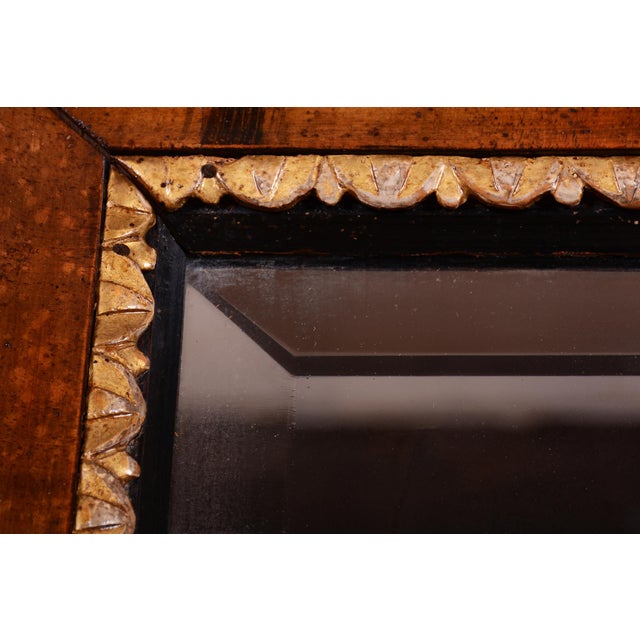 This noble hanging mirror is an excellent example of the purity and elegance of the Empire style. Originating from early...