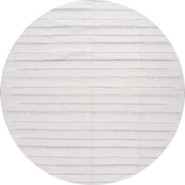 Beautiful 21st-Century Modern Swedish hand-knotted wool rug with an ivory field, beige, and gray accents in an all-over...