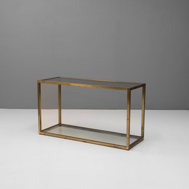 Late 20th Century two tier console table with patinated brass frame and smoked glass. U.K circa 1980.