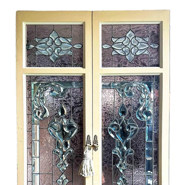 Pair of late 20th century doors/shutters. Mixed beveled and stained glass panels.