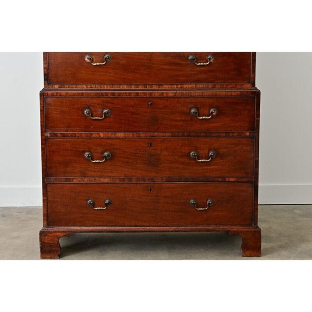 English 19th century towering chest-on-chest in the Georgian style, circa 1850, built from mahogany with beautiful...
