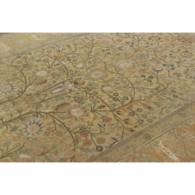 This 8x11 antique Persian Tehran rug, hand-knotted in wool and natural silk circa 1900–1919, features an elegant Tree of...