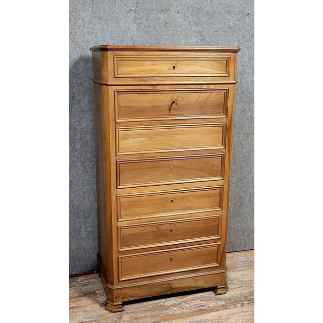 Napoleon III period secretary desk, disguised as a chest of drawers, in walnut, circa 1850 The front opens with five...
