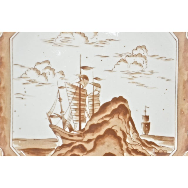 Vintage octagonal chinoiserie plate with sea bound sail ships or junks in sepia brown tones. Wood stand included. Plate,...