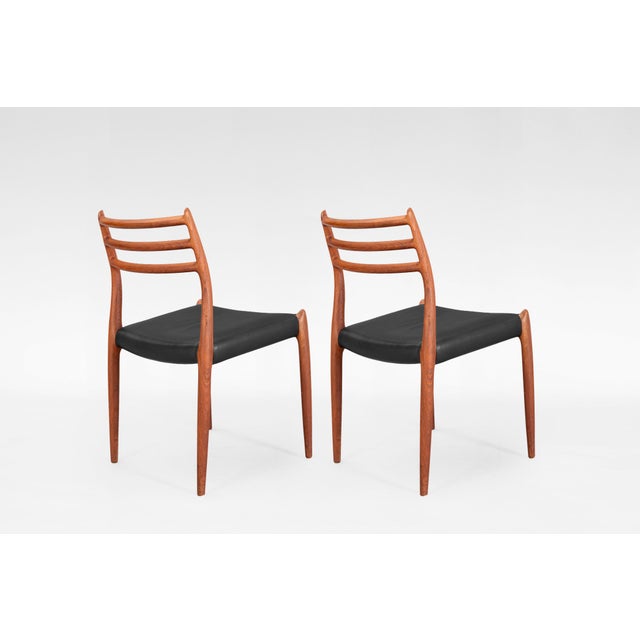 This set of 2 Model 78 dining chairs, designed by Niels Otto Møller in the 1950s and produced by J.L. Møller Møbelfabrik...