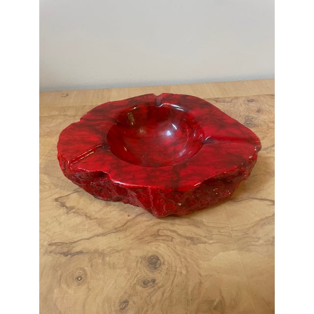 A striking, heavy-duty mid-century modern sculptural stone ashtray beautifully hand-carved from premium red alabaster...