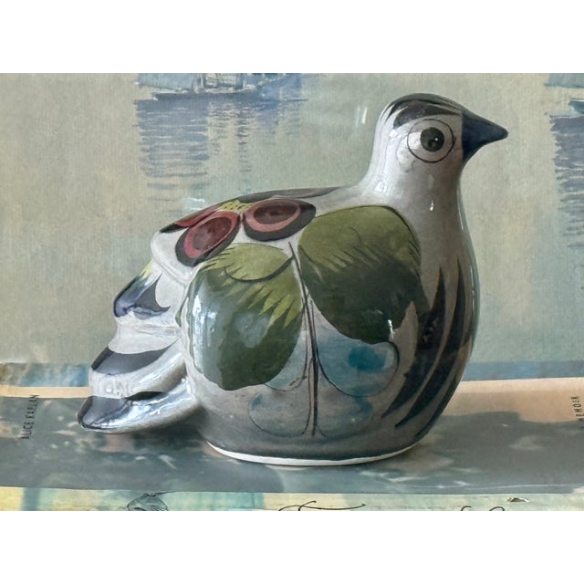 Beautiful Tonala folk art pottery bird with colorful florals made by a Mexican artisan. The delightfully round bird...