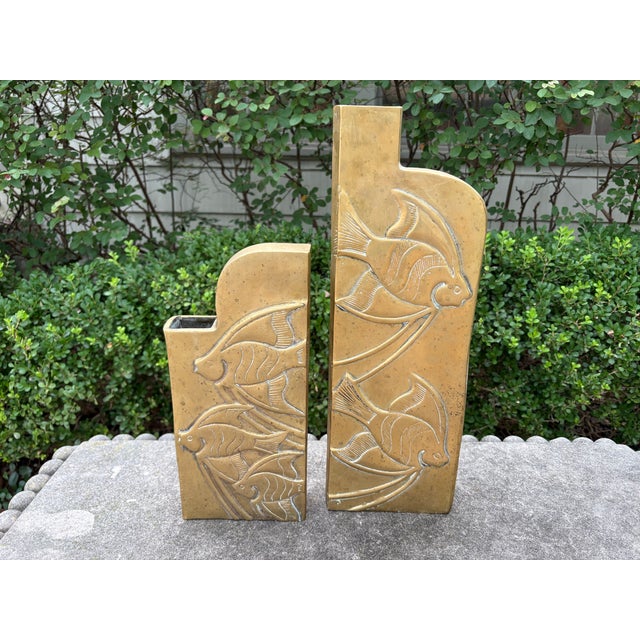 Pair Of Dolbi Cashier Brass Vases With Fish. Offered is a lovely pair of Hollywood Regency brass vases decorated with...