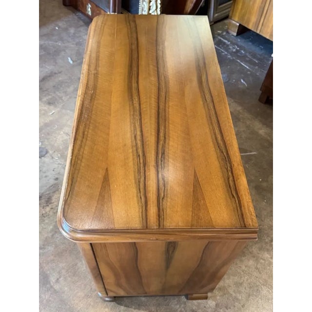 Beautiful 19th century Italian walnut cabinet. Featuring a very polished finish with lovely variation in the wood grain. A...