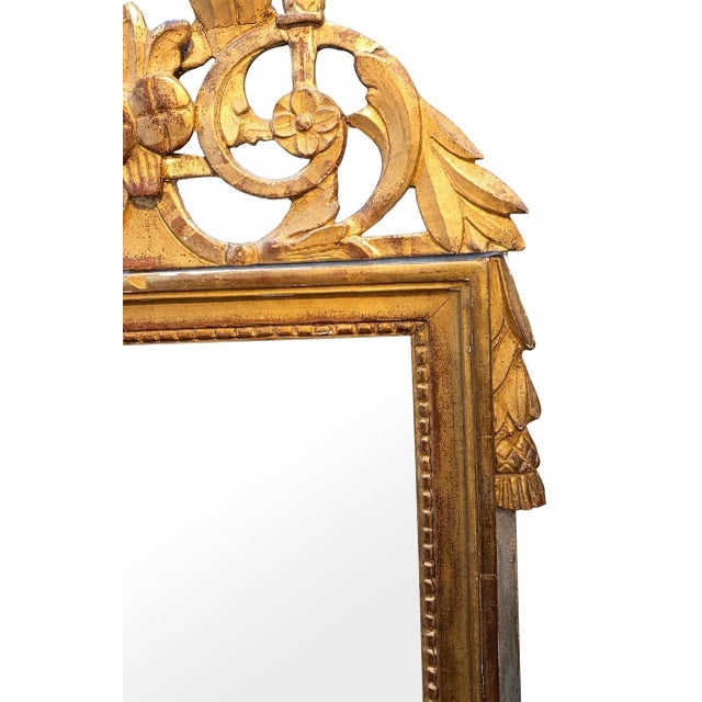 A Louis XVI period wedding mirror in gilded wood, traditionally given to newlyweds as a token of prosperity and fidelity....