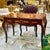 Elevate your office or study with this stunning French Louis XV-style writing desk, featuring an exquisite floral...