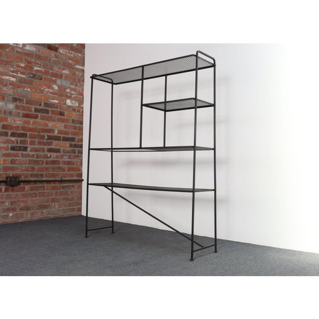 Versatile, modernist shelving unit designed by MOMA Good Design winner, Freda Diamond, for Baumritter, (ca. 1954, USA)....